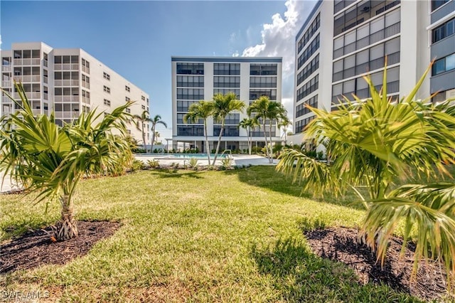 view of home's community with a lawn