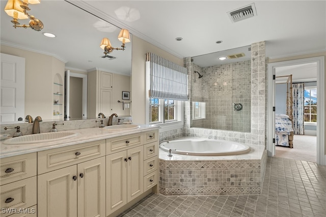 bathroom with visible vents, a tile shower, a sink, and ornamental molding