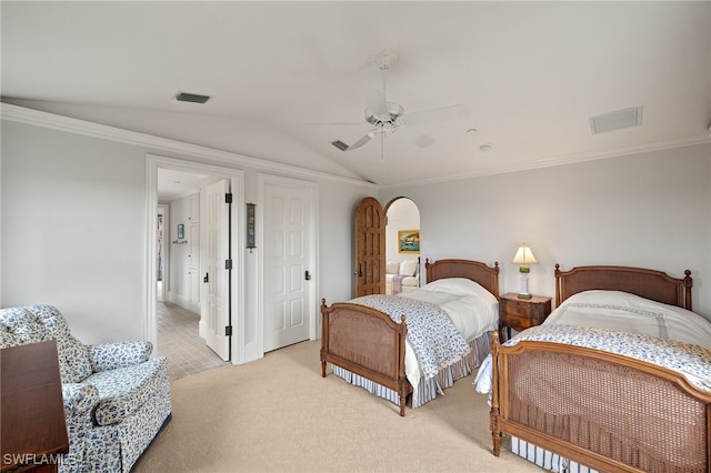 bedroom with visible vents, vaulted ceiling, crown molding, and light colored carpet