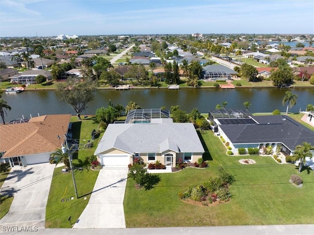 birds eye view of property featuring a residential view and a water view