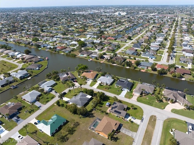 aerial view featuring a water view and a residential view