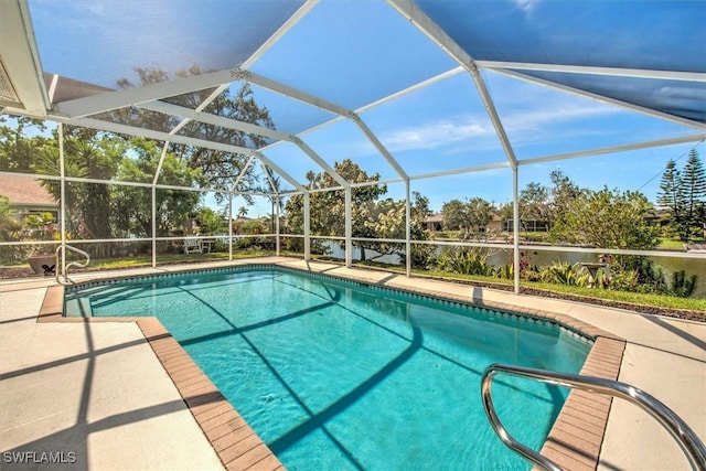 outdoor pool with a patio area and a lanai