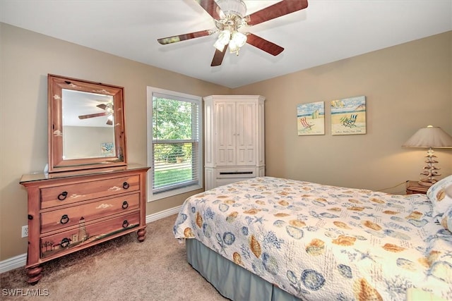 carpeted bedroom featuring ceiling fan and baseboards