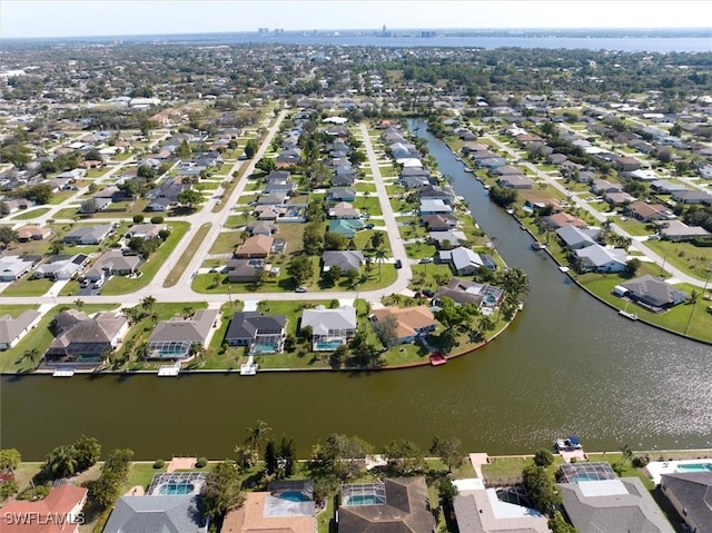 bird's eye view with a water view and a residential view