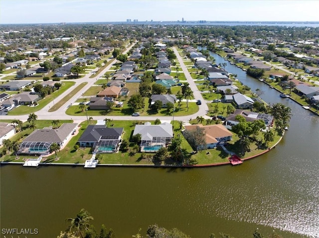 bird's eye view with a residential view and a water view