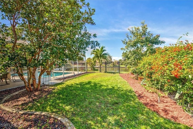 view of yard with a fenced backyard and a fenced in pool