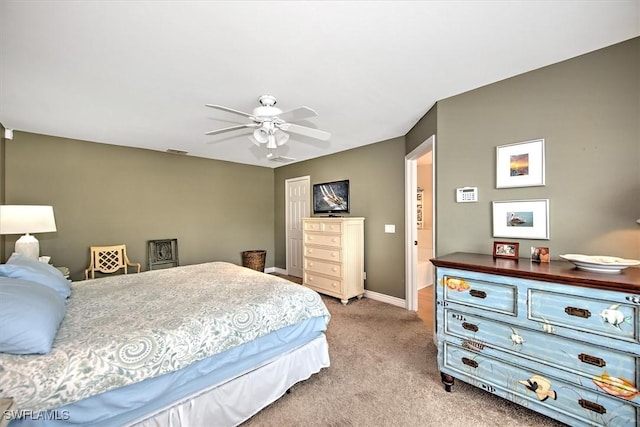 carpeted bedroom with a ceiling fan, visible vents, and baseboards