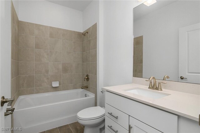 bathroom featuring  shower combination, toilet, and vanity