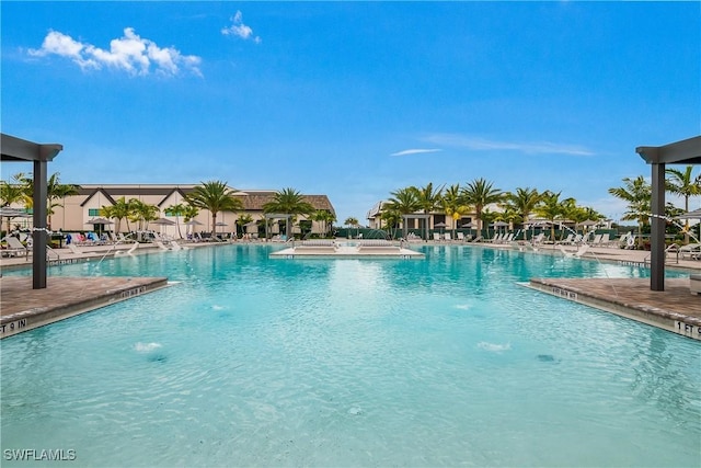 community pool with a patio area