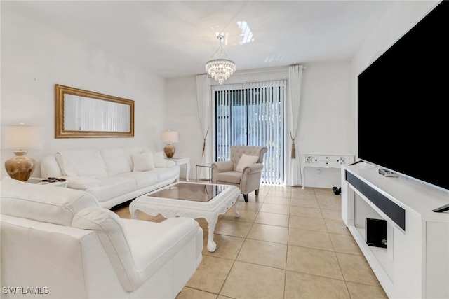 living area featuring light tile patterned floors and an inviting chandelier