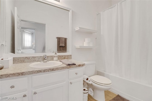 bathroom featuring toilet, tile patterned floors, shower / bath combination with curtain, and vanity