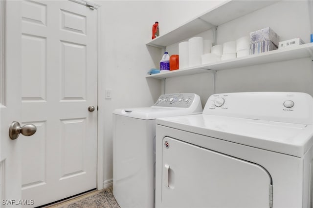 washroom with laundry area and separate washer and dryer