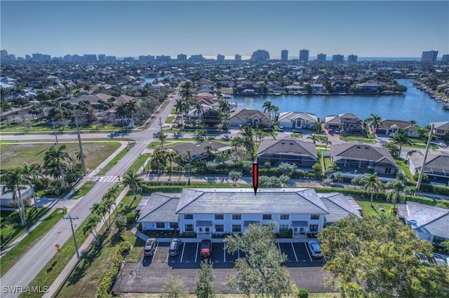 bird's eye view featuring a water view and a city view