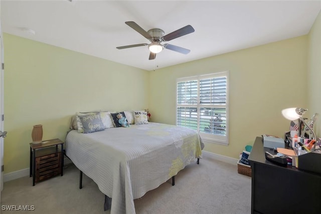 bedroom featuring ceiling fan, carpet, and baseboards