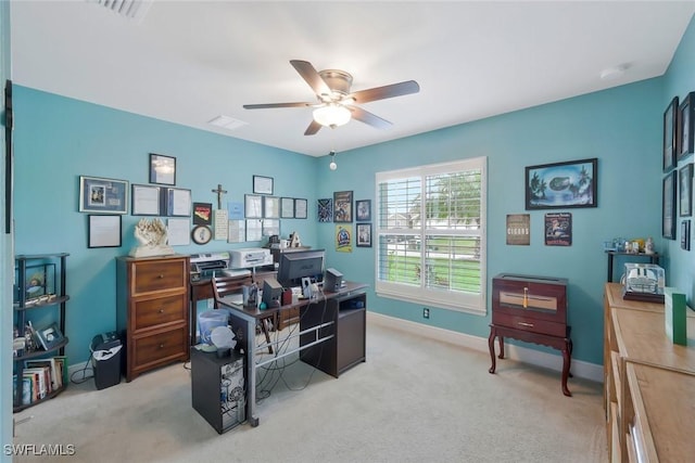 home office featuring ceiling fan, light carpet, visible vents, and baseboards