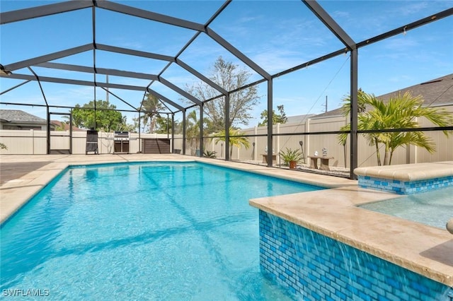 view of swimming pool featuring a patio area, fence, and a fenced in pool