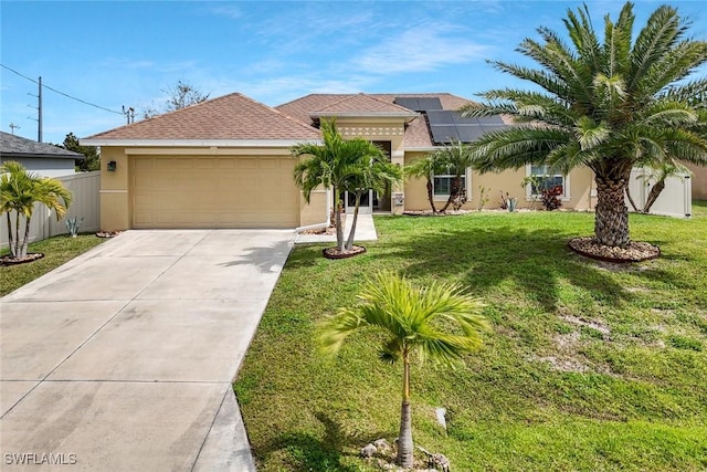 mediterranean / spanish home with stucco siding, a front yard, fence, a garage, and driveway