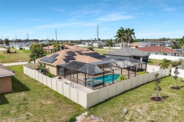 view of swimming pool with a residential view and a yard