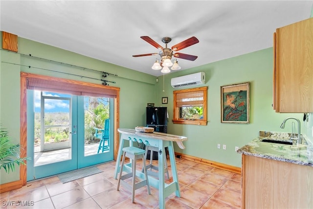 dining area featuring light tile patterned floors, ceiling fan, an AC wall unit, and baseboards