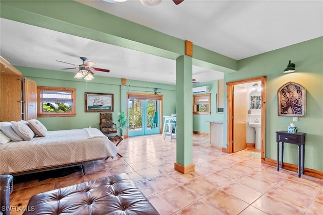 bedroom featuring ceiling fan, a wall unit AC, light tile patterned floors, baseboards, and access to exterior