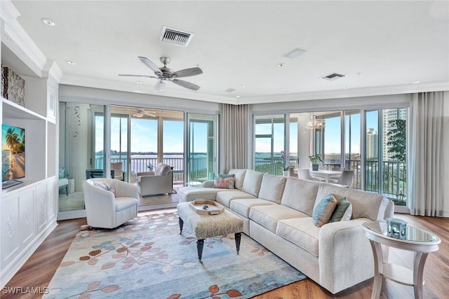 sunroom with visible vents and a ceiling fan