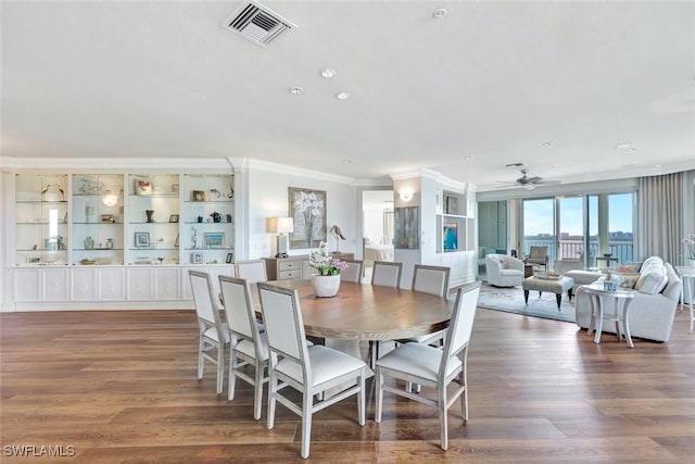 4811 Island Pond Ct Unit 705, Bonita Springs, FL 34134 - dining room featuring visible vents, crown molding, a ceiling fan, and wood finished floors