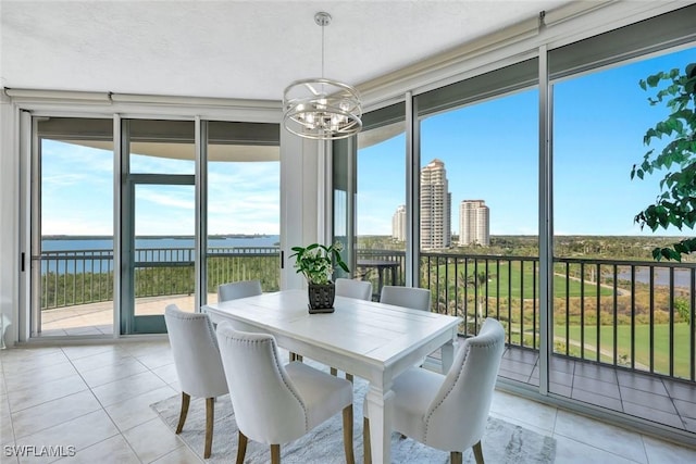 4811 Island Pond Ct Unit 705, Bonita Springs, FL 34134 - sunroom with an inviting chandelier and a healthy amount of sunlight