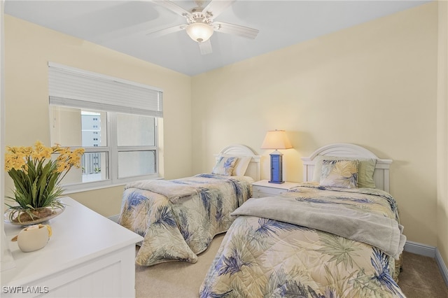 bedroom featuring carpet flooring, a ceiling fan, and baseboards