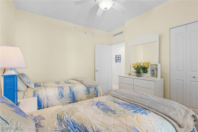 bedroom featuring a ceiling fan, a closet, and visible vents