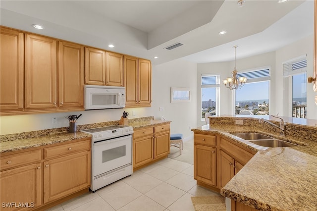 kitchen featuring white appliances, visible vents, a sink, and recessed lighting