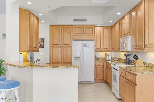 kitchen featuring recessed lighting, visible vents, light tile patterned flooring, white appliances, and a peninsula