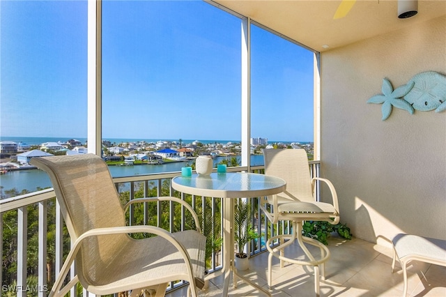 balcony featuring a water view