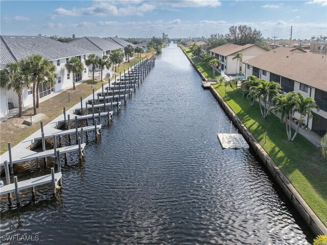 exterior space featuring a residential view and a water view