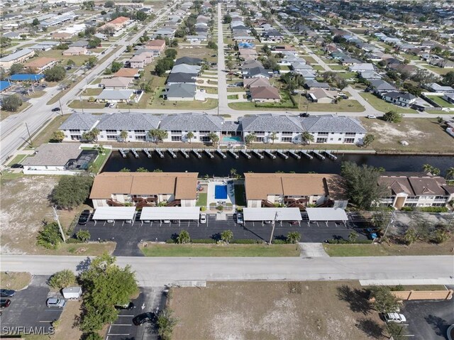 aerial view featuring a residential view and a water view