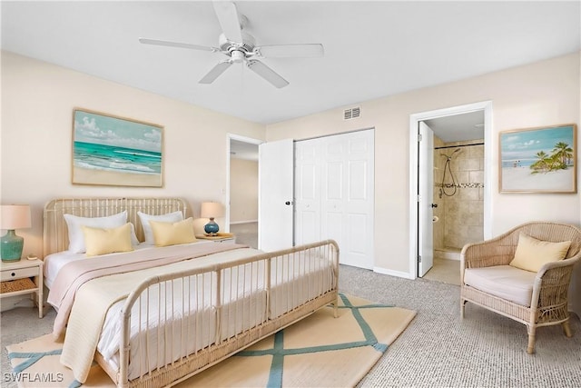 bedroom with carpet floors, a closet, a ceiling fan, connected bathroom, and baseboards