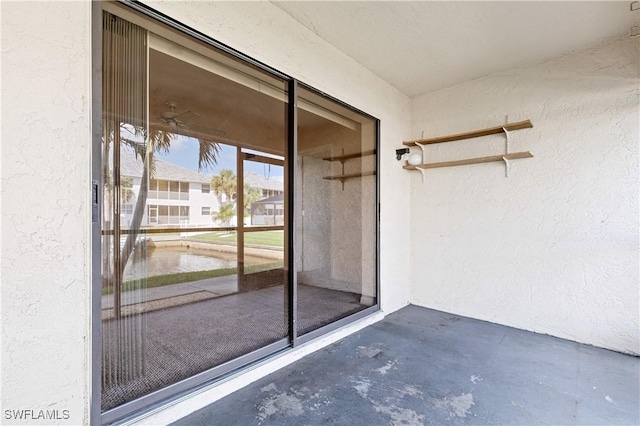 view of exterior entry featuring stucco siding