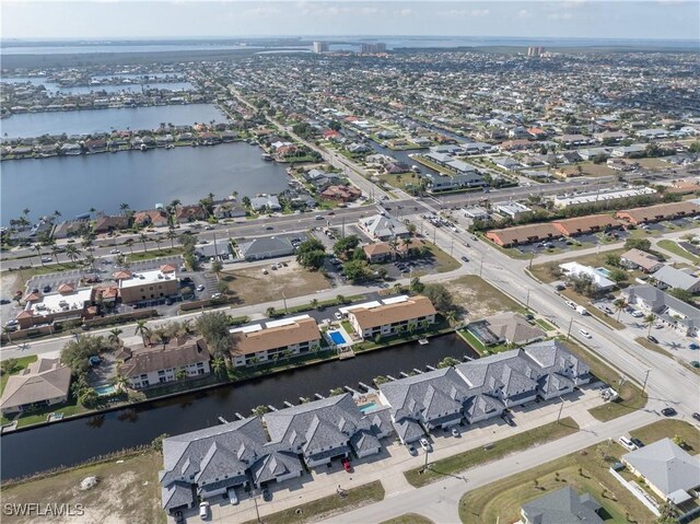 aerial view with a residential view and a water view