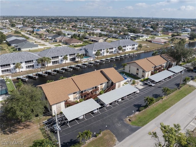 aerial view featuring a residential view and a water view