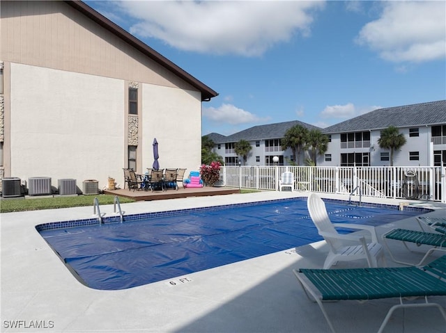 719 SW 47th Ter Unit 101, Cape Coral, FL 33914 - community pool featuring a patio area and central AC unit