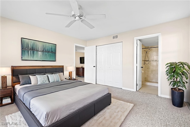 719 SW 47th Ter Unit 101, Cape Coral, FL 33914 - bedroom featuring carpet flooring, baseboards, a closet, ensuite bath, and a ceiling fan