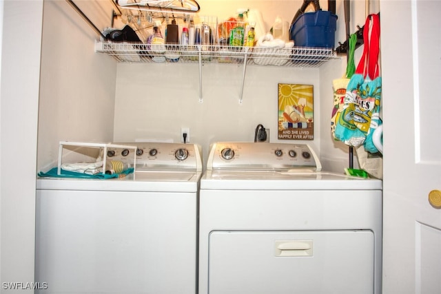 laundry area with laundry area and separate washer and dryer