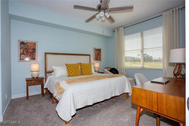 carpeted bedroom featuring a ceiling fan and baseboards