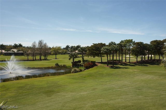 surrounding community featuring a water view and a yard