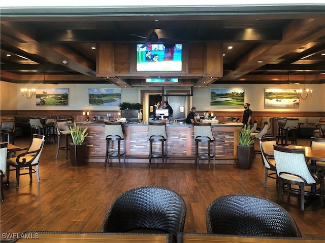 bar featuring visible vents, a notable chandelier, and wood finished floors