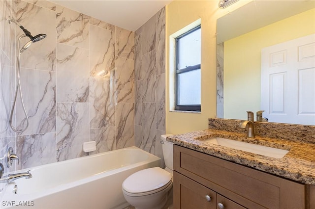 full bathroom featuring toilet, bathing tub / shower combination, and vanity