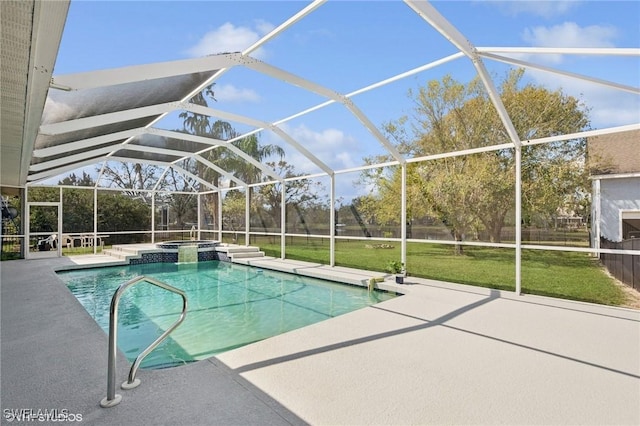 view of pool featuring a lawn, a lanai, a pool with connected hot tub, and a patio area