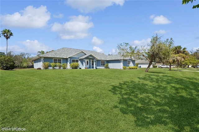 single story home featuring a front yard