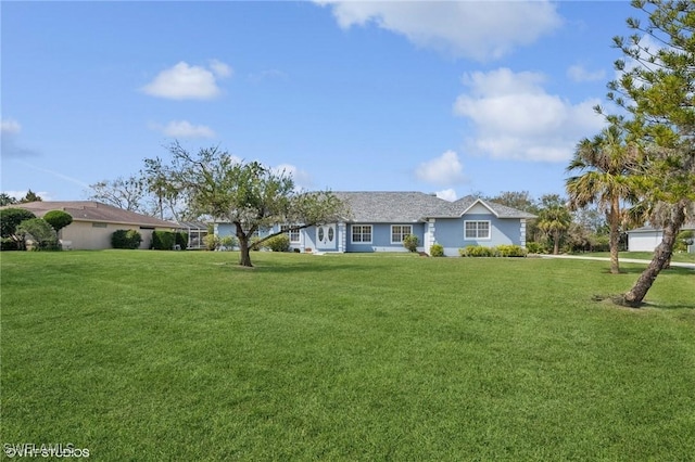 single story home featuring a front yard