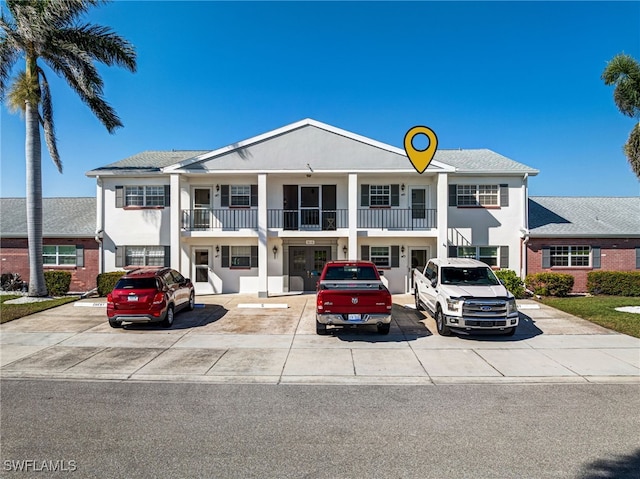 1515 Myerlee Country Club Blvd Unit 6, Fort Myers, FL 33919 - neoclassical home with stucco siding and uncovered parking