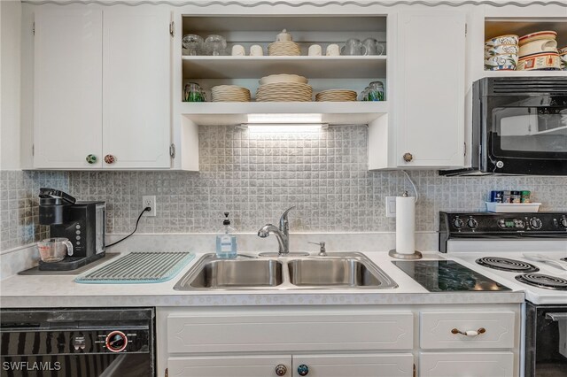 kitchen featuring open shelves, light countertops, white cabinets, a sink, and black appliances